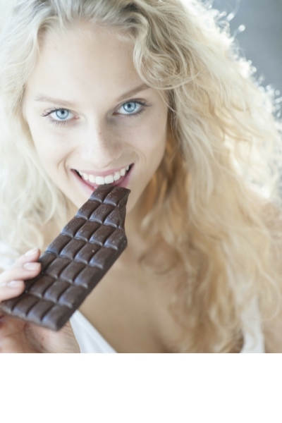 Woman Eating Candy Bar